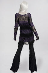 sweater with loose mid-length cut that allows free layering over inner tops, camisoles and dresses