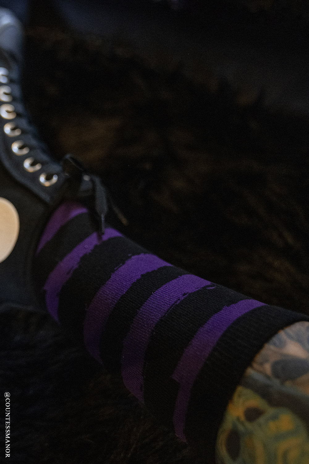 purple and black striped socks