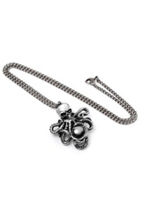 Silver octopus pendant on a chain against a white background
