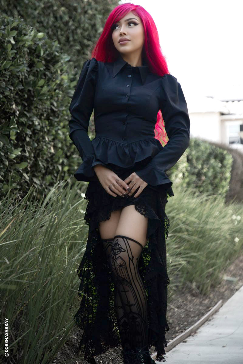gothic woman wearing victorian flocked gothic cathedral thigh highs