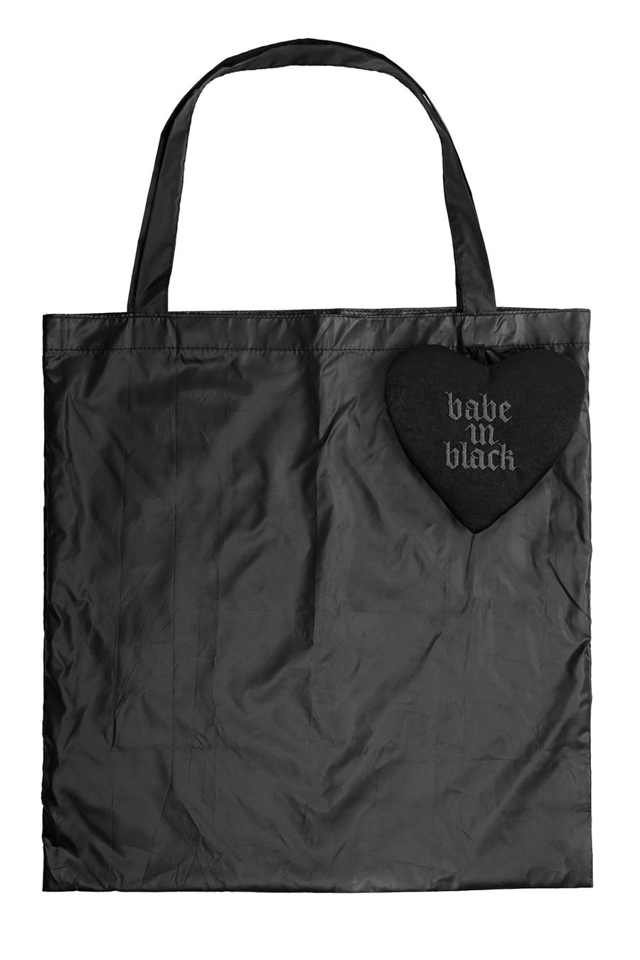 Black tote bag with a heart-shaped keychain made of velvet reading 'babe in black' on a white background