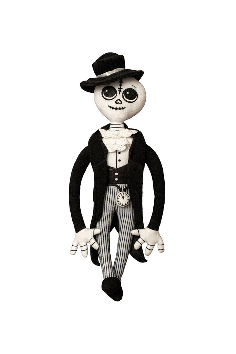 Skeleton plush toy in formal attire with a top hat on a white background