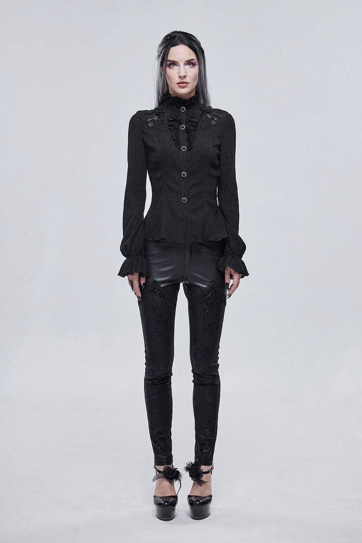 Person wearing a black gothic outfit on a white background