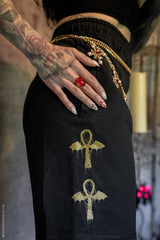 black cotton jersey sweat-shorts with ankh symbols printed on the sides