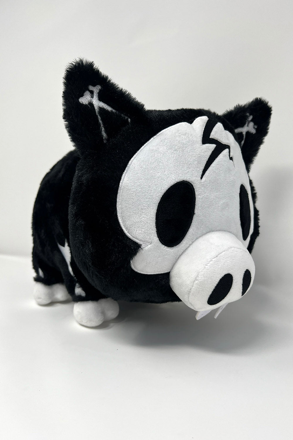 funny black and white stuffed animal skeleton plushie with spiral tail