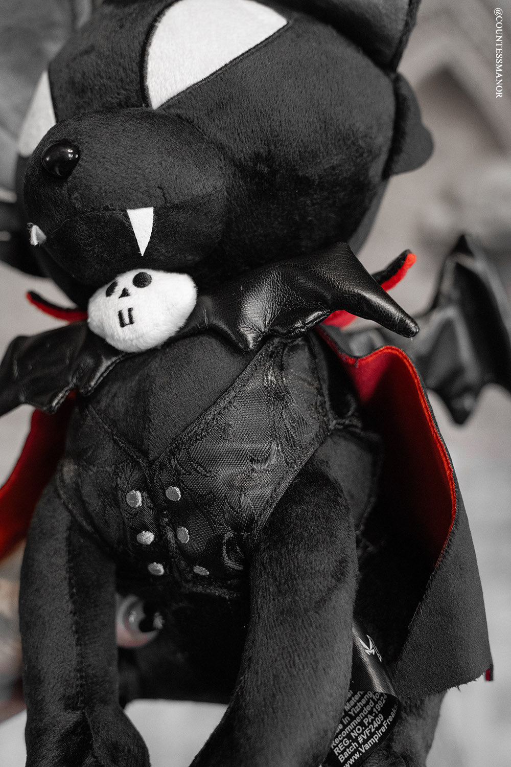 cat plush with vampire cape