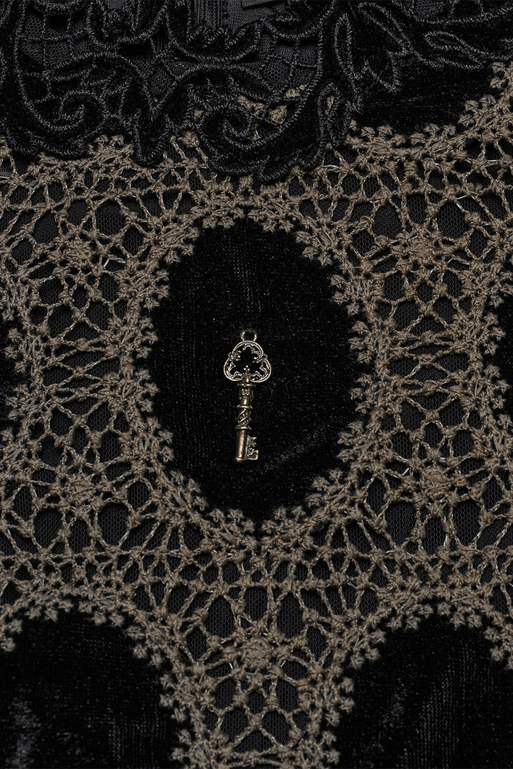 romantic key pendant attached to a puff shoulder long sleeve lace top