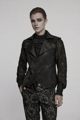 Person wearing a black, ornate outfit with lace details on a plain background