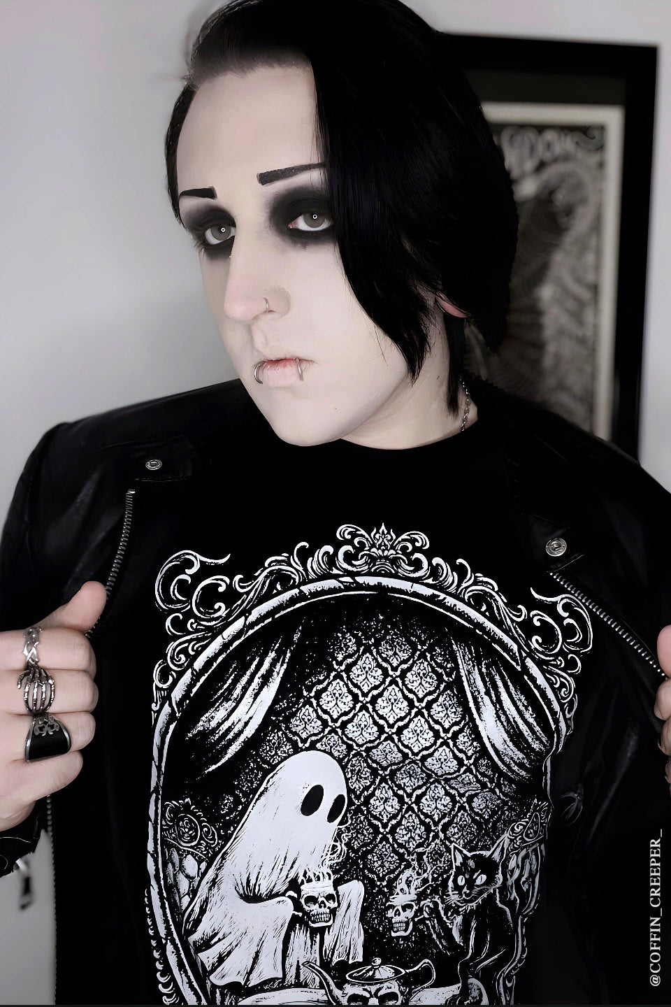 goth guy wearing a Victorian cameo frame ghost and black cat shirt