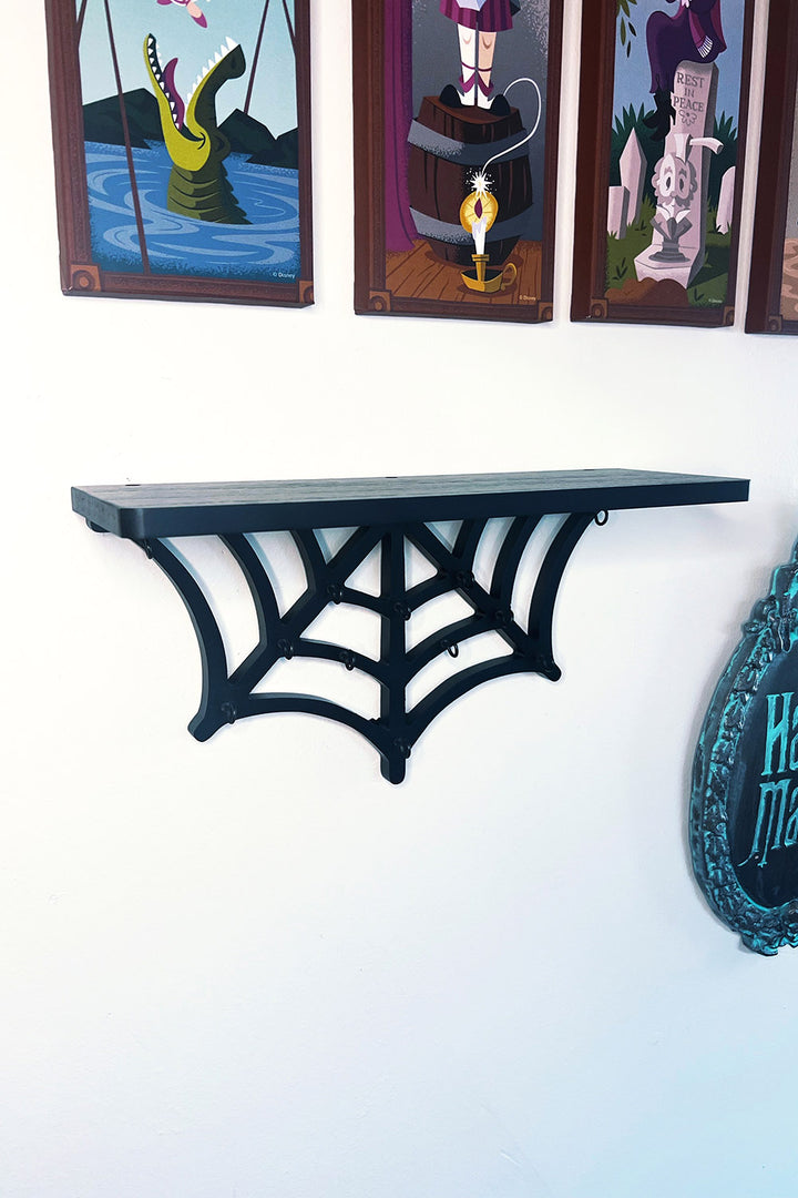 black spooky spiderweb wall shelf