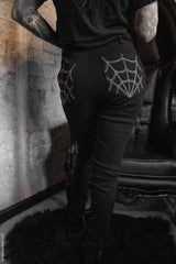 high-waisted corset pants with embroidered spiderweb pockets