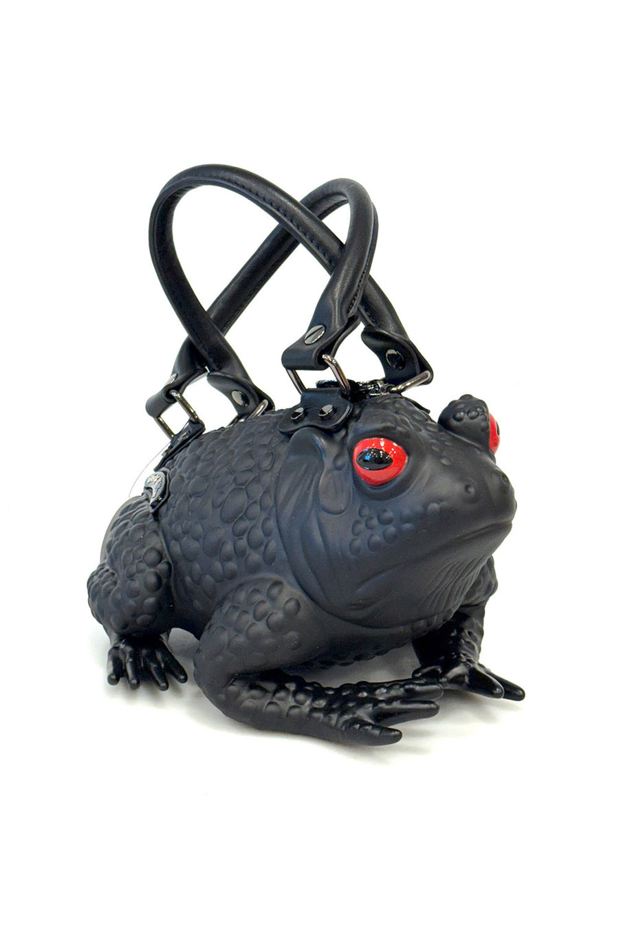 Black frog-shaped handbag with red eyes on a white background