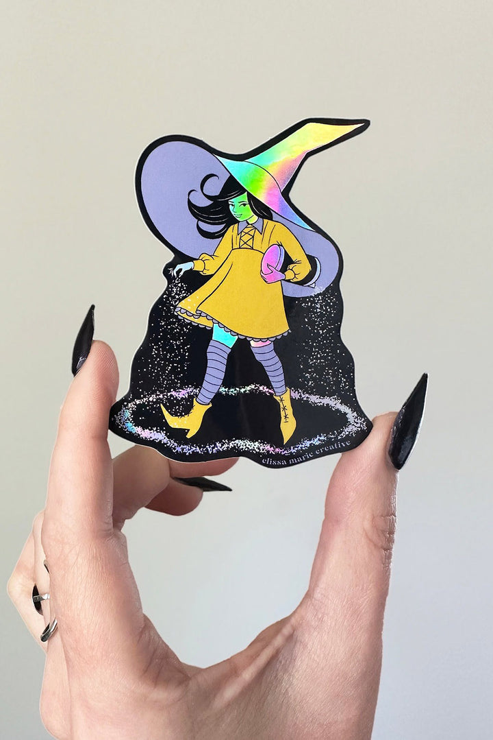 sticker of a cute witch