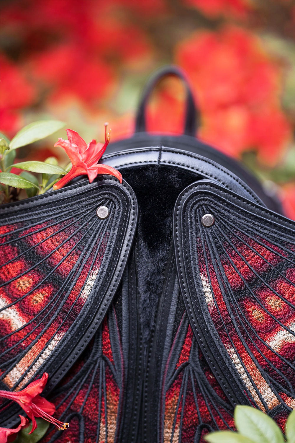 Restyle crimson moth backpack with embroidery with realistic details and vivid colors