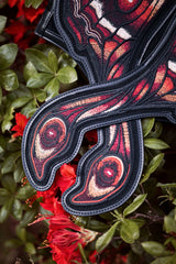 Moth backpack with soft black faux fur on the body and between the wings