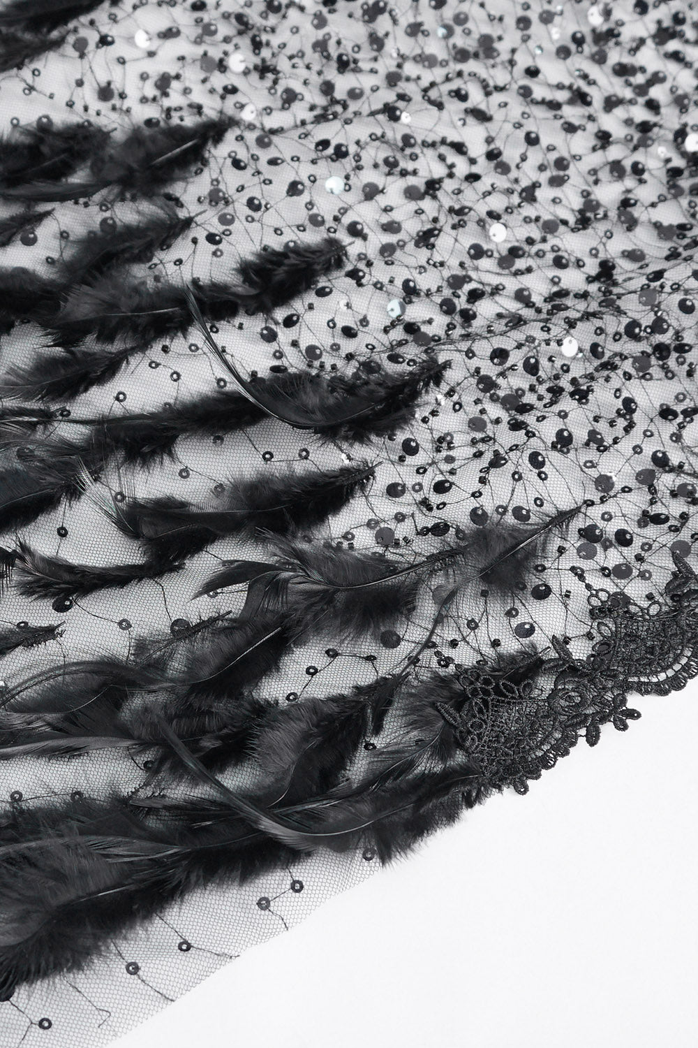 faux feathered cape with black faux gems