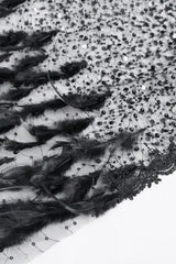 faux feathered cape with black faux gems