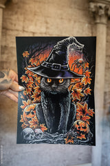 Black cat in a witch hat surrounded by autumn leaves, pumpkins, and a skull puzzle