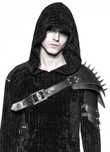 A person wearing a black hooded coat with silver cone spikes on the shoulder armor.