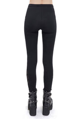 Leggings con aberturas y dijes victorianos