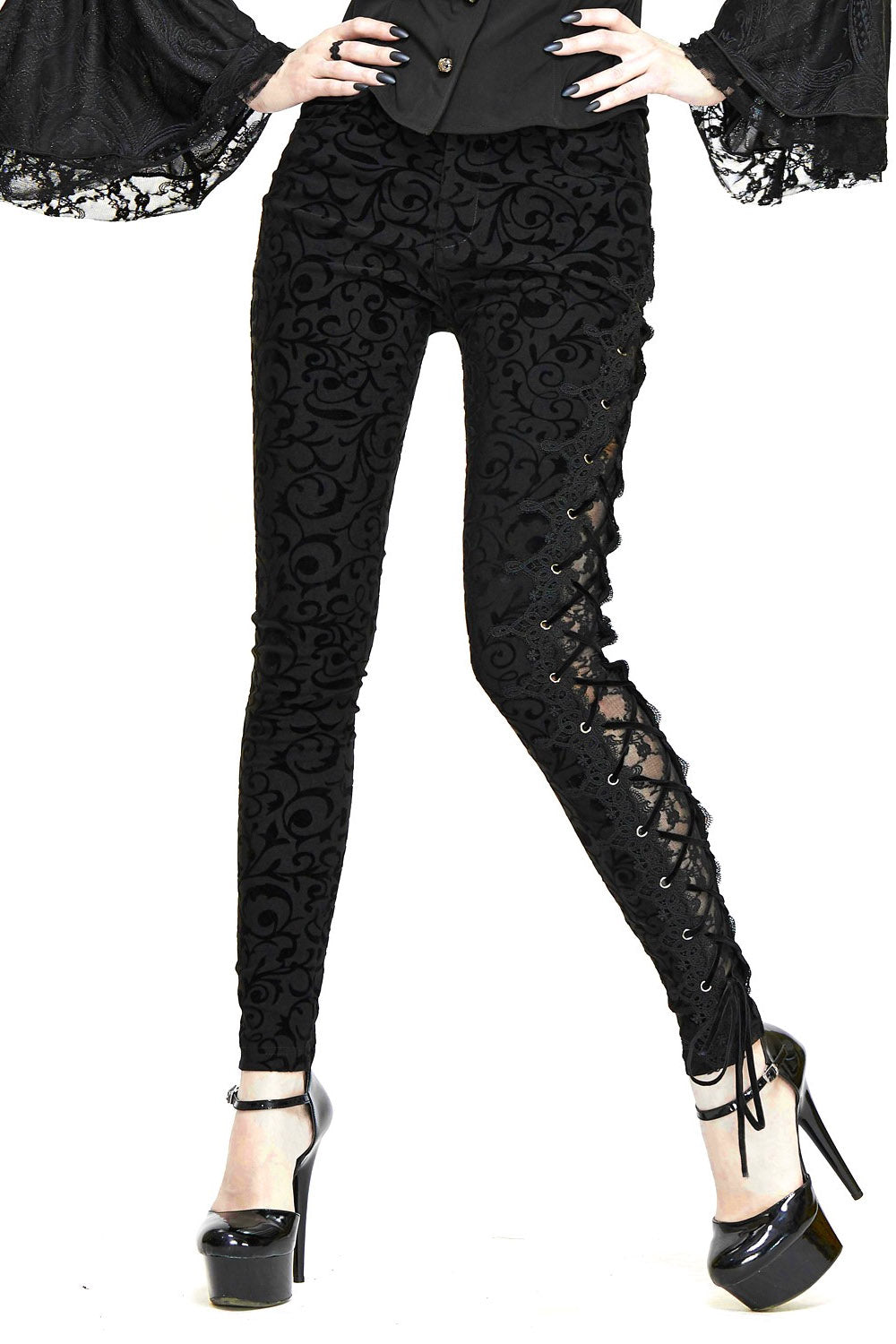 Black lace pants worn by a person on a white background