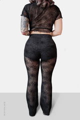 Pantalones acampanados de malla con diseño de telaraña