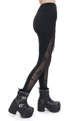Leggings con aberturas y dijes victorianos