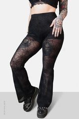 Pantalones acampanados de malla con diseño de telaraña